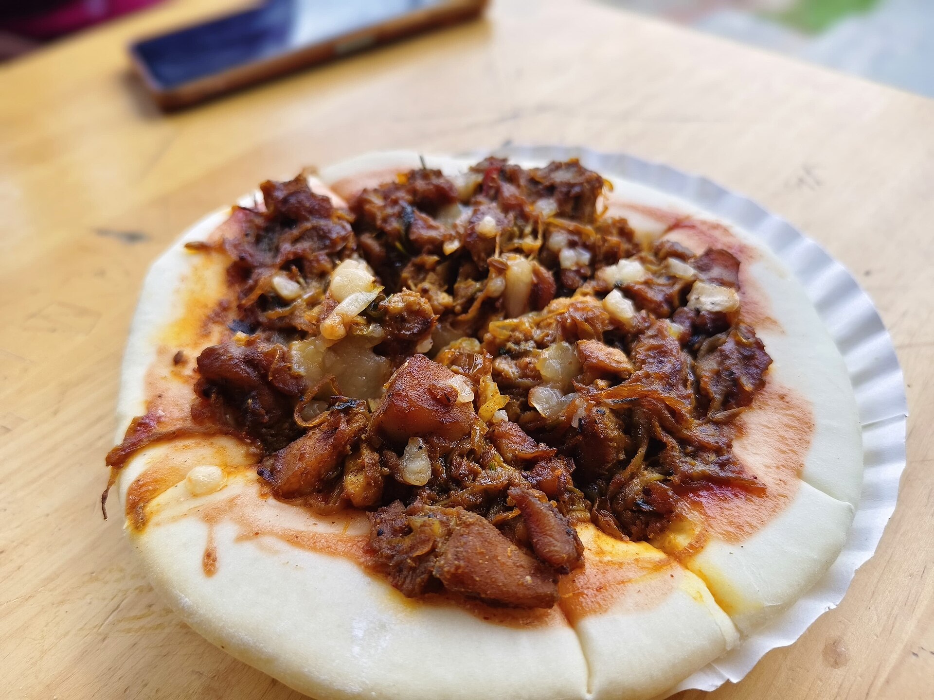 A freshly baked pizza on a wooden board