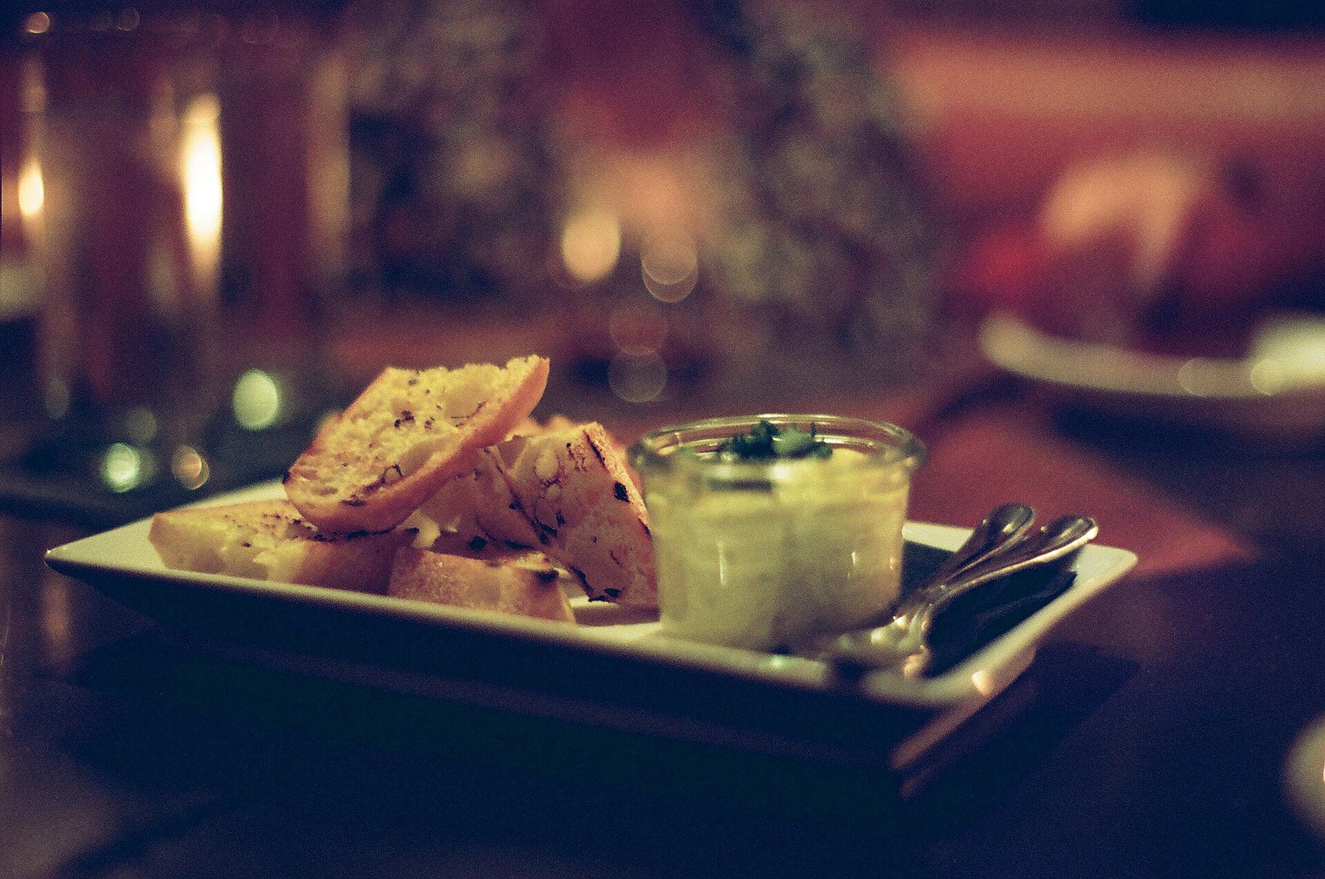Small plates at a warmly lit restaurant table